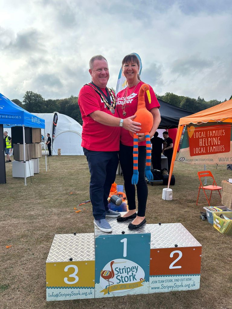 Mayor and Mayoress on the Stripey Stork podium at Run Reigate 2023