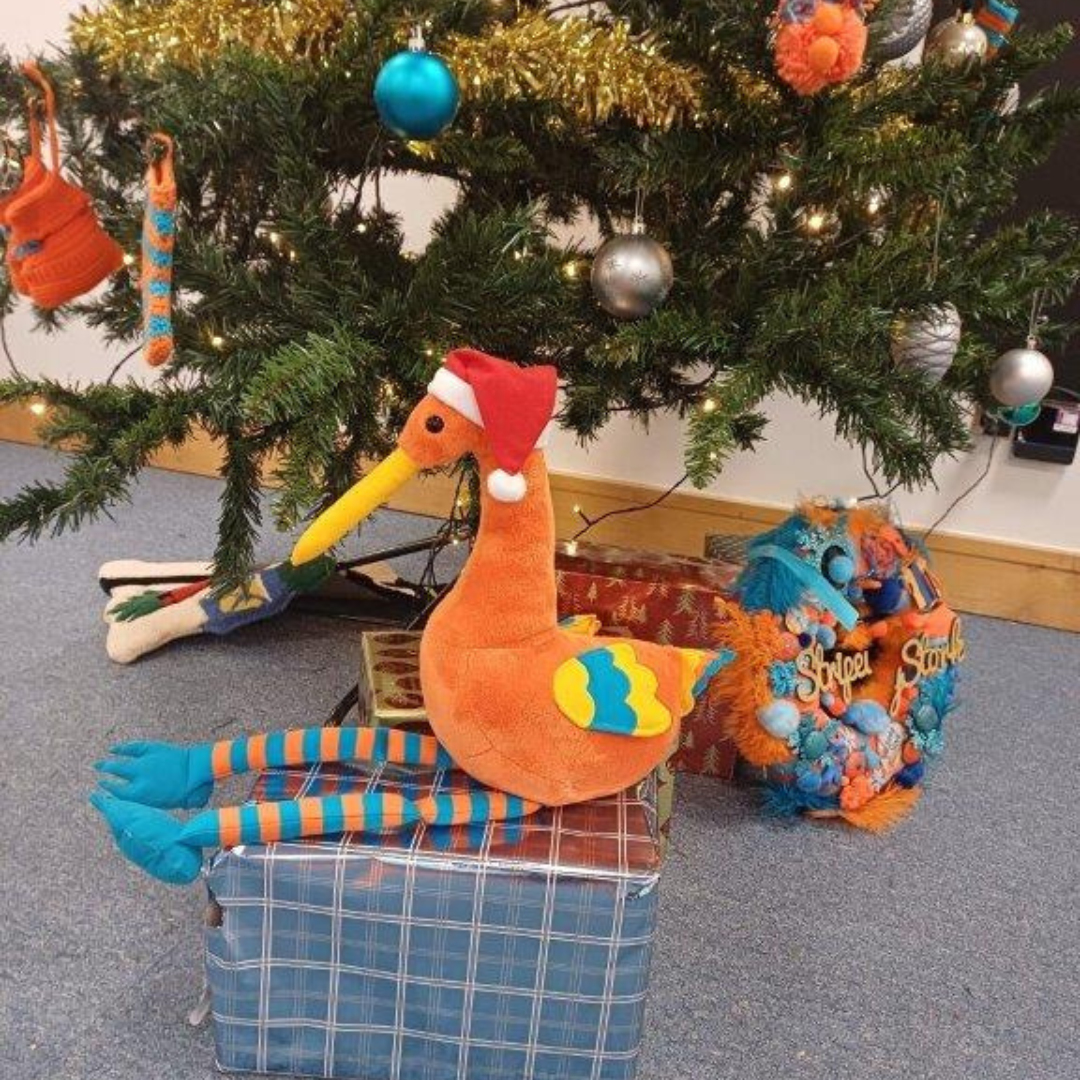 Stripey sitting under the tree at Santa Stork